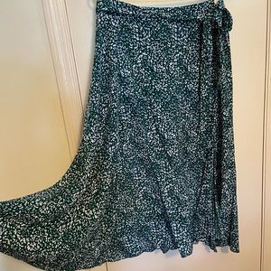 Skies Are Blue Faux Wrap Green Saige Pleated Midi Skirt from Stitch Fix